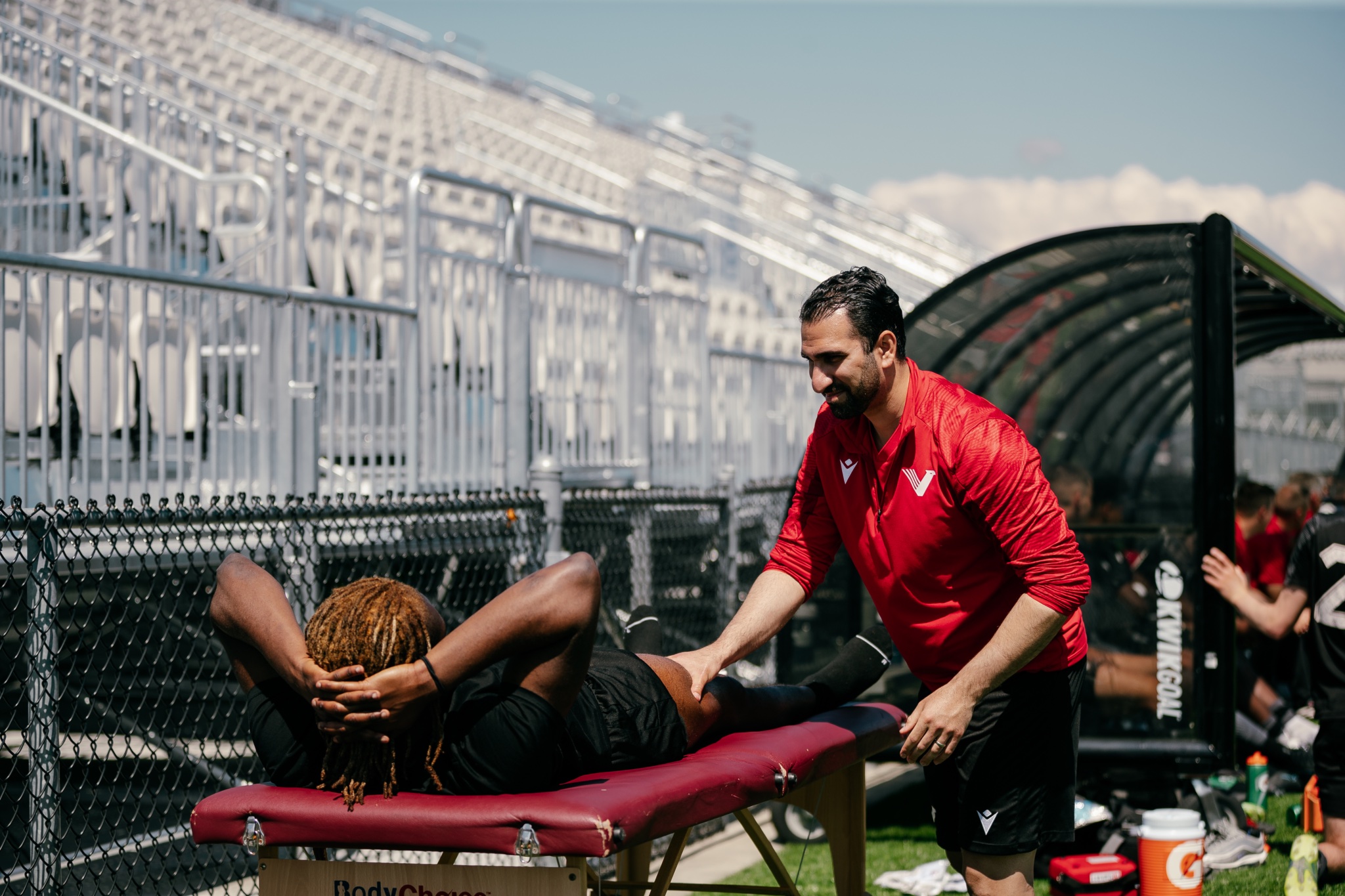 Locus Health RMT treating soccer player on sideline